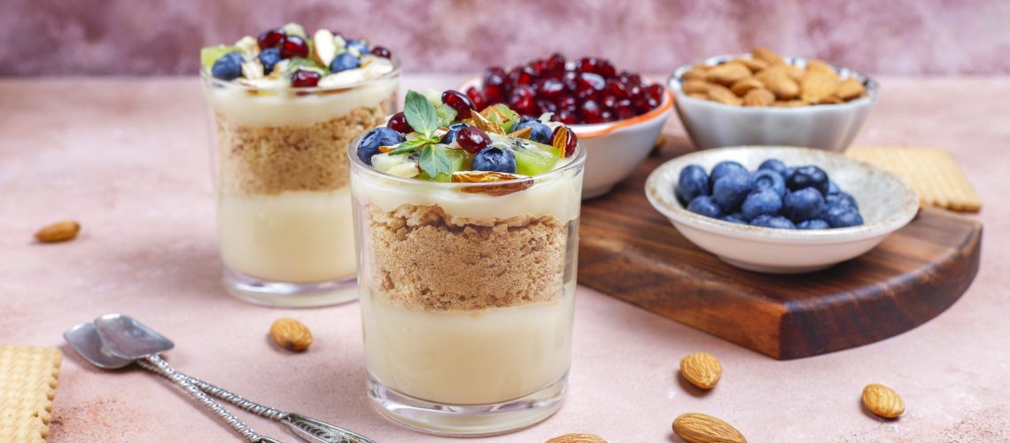 Layered trifle dessert in serving glasses.